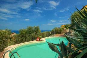 Casa con piscina, vista mare, patio privato, AC, posto auto e wi-fi